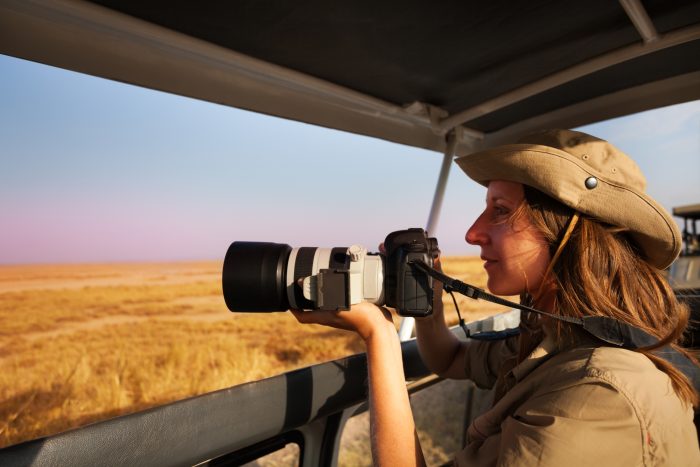 woman doing wildlife photography as one of the types of photography